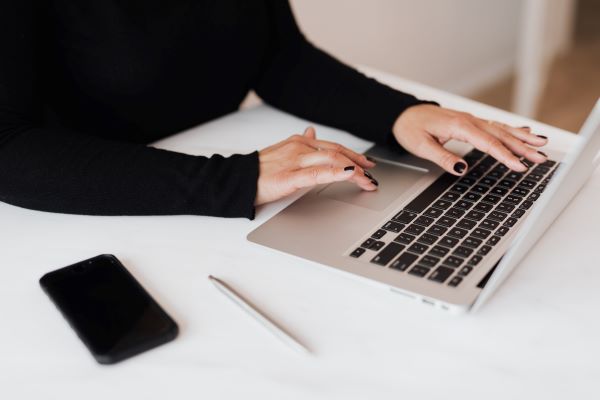 software recruiter typing on computer