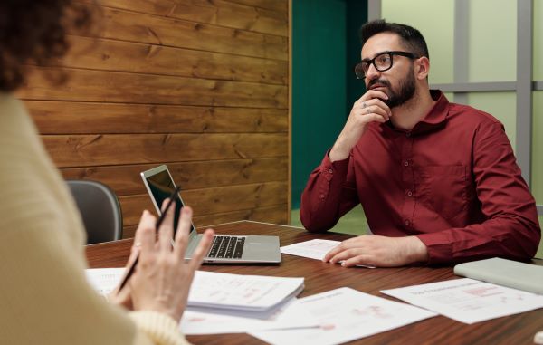 man looks worried in performance review